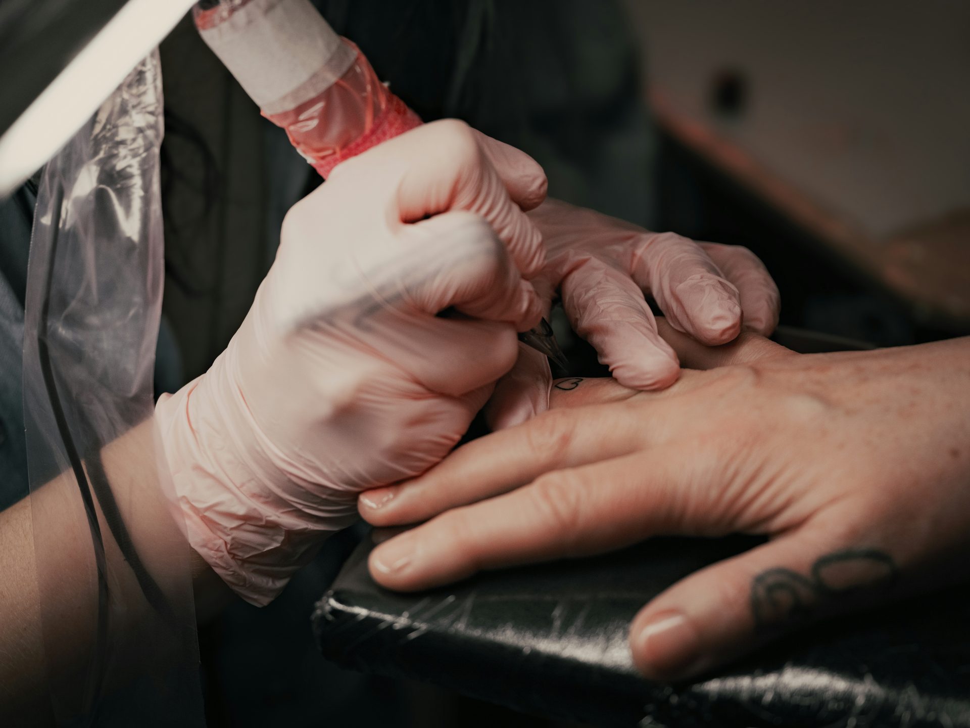 A person getting a tattoo on their arm