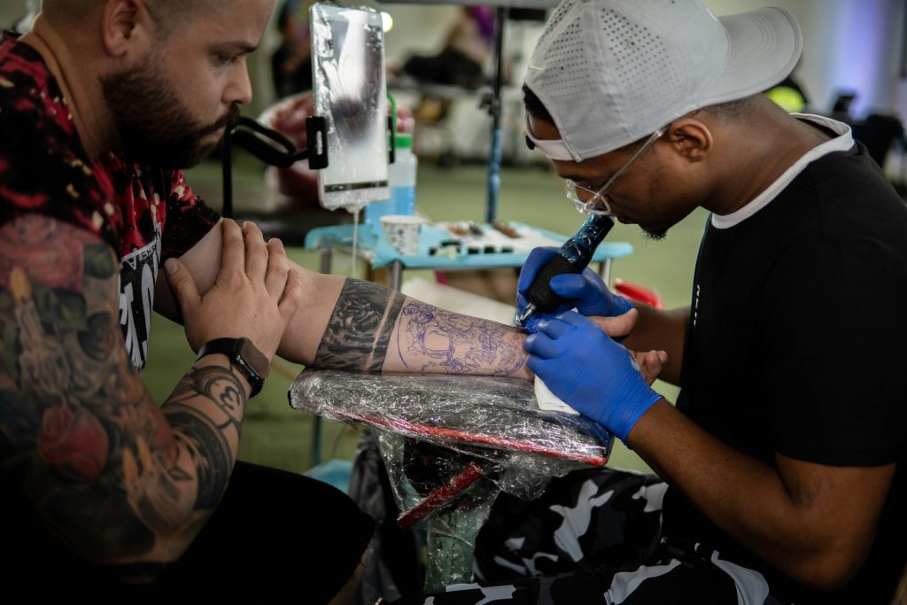 a man getting a tattoo